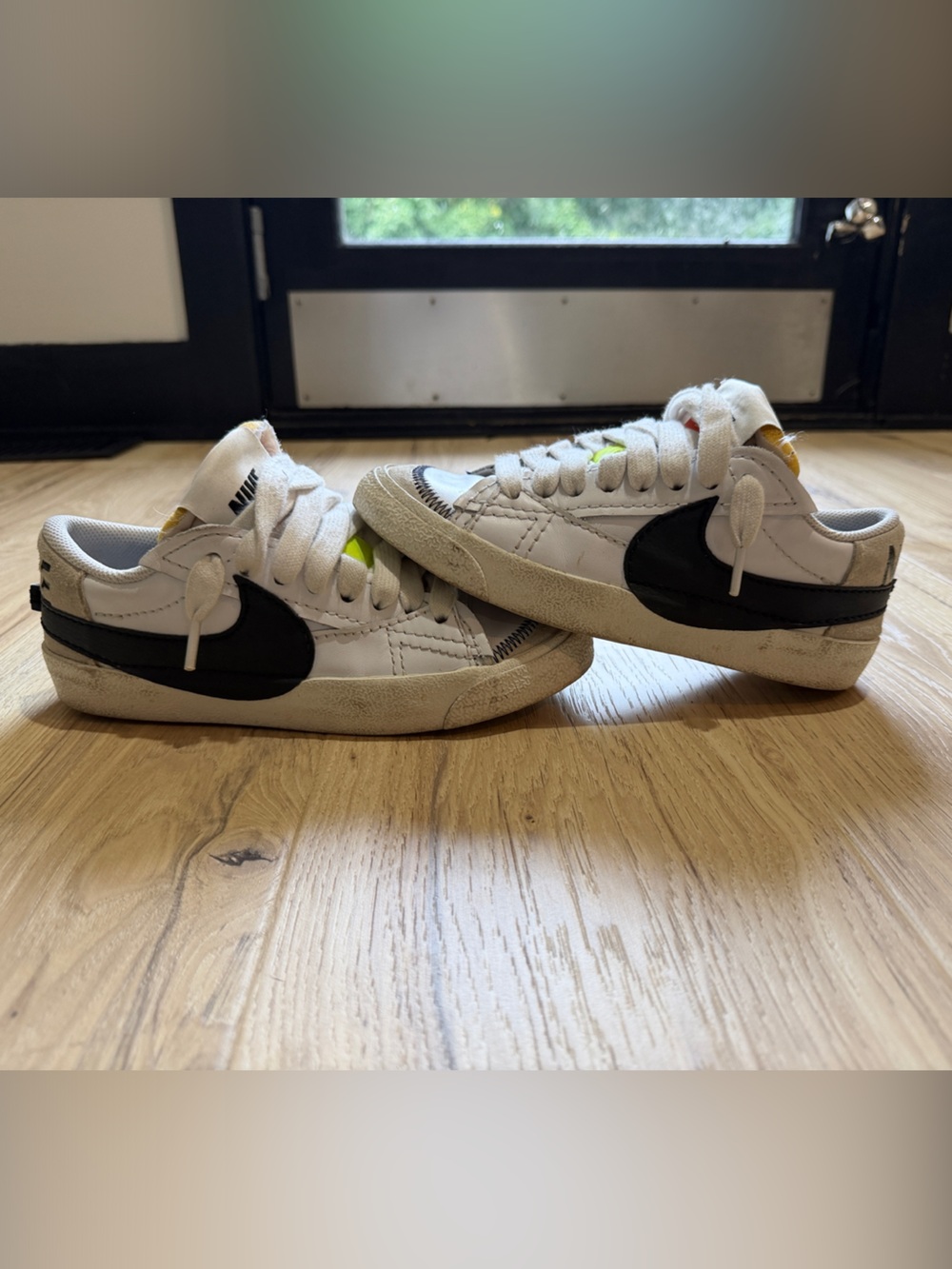 Nike Kids White Sneakers with Black Swoosh and Neon Accents
